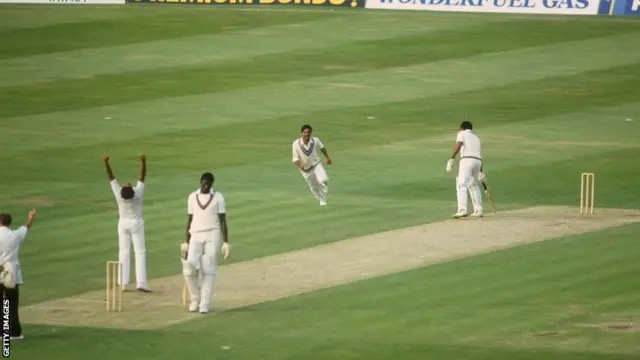 Andy Roberts of the West Indies loses his wicket to India's Kapil Dev