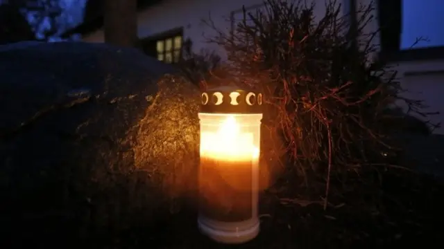 A candle has been placed in front of the home of the family of Andreas Lubitz in Montabaur, Germany, Thursday, March 26, 2015.