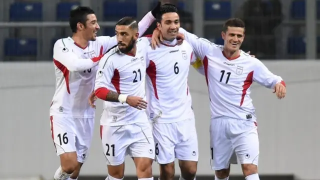 Iran celebrate scoring against Chile