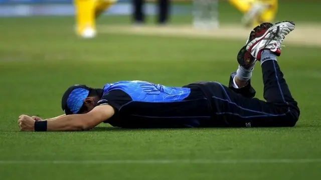 Ross Taylor reacts after failing to stop a ball