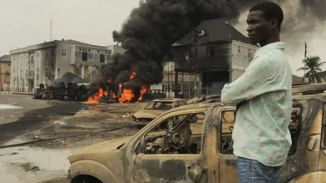 A Nigerian man looks over the scene where an oil tanker carrying fuel exploded following an accident in the oil rich Niger Delta, Port Harcourt, Nigeria 31 March 2015