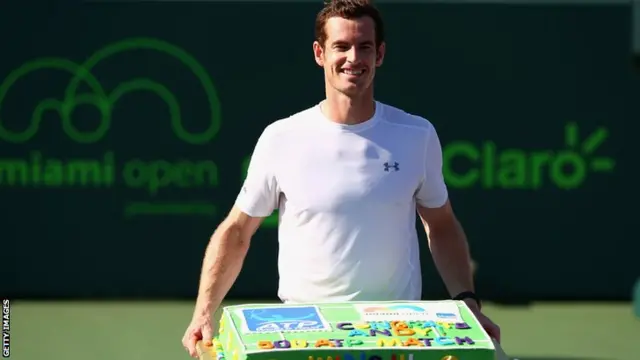 Andy Murray with a cake to celebrate his 500th win