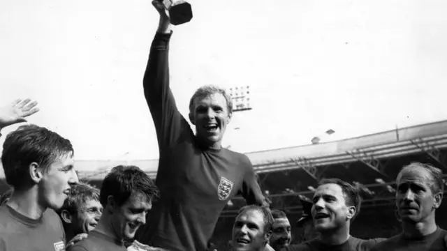 Bobby Moore holds aloft the Jules Rimet trophy in 1966