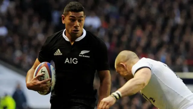 Charles Piutau of New Zealand breaks past Mike Brown of England during an international in 2013