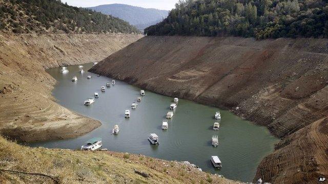 In this Thursday, October 30, 2014, file photo, houseboats float in the drought-lowered waters of Oroville Lake near Oroville, California