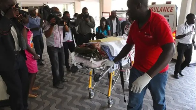 Medics help an injured person at Kenyatta National Hospital in Nairobi, Kenya, Thursday 2 April 2, 2015, after being airlifted from Garissa