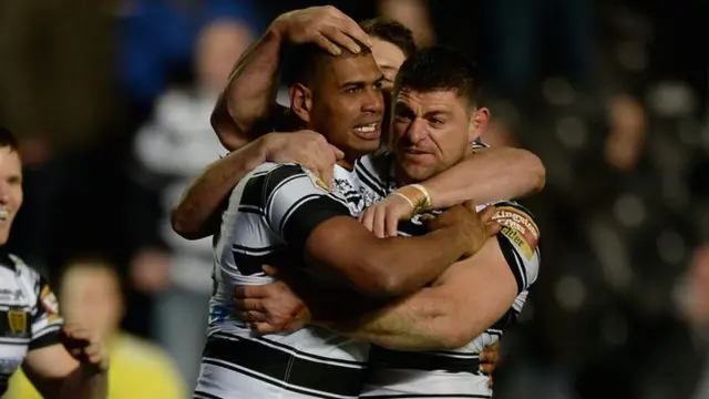 Leon Pryce and Mark Minichiello celebrate a try