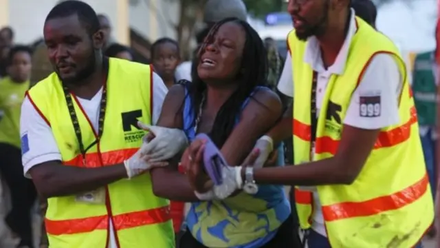 A woman reacts as she is rescued out of the building where she had been held hostage as Kenyan soldiers entered the university building after a fierce fights with attackers at the Garissa University in Garissa town