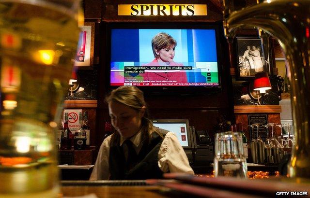 SNP Leader Nicola Sturgeon seen on a TV in a pub in Salford