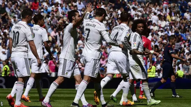 Real Madrid players celebrate yet another goal against Granada