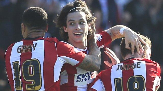 Brentford players celebrate their injury-time equaliser against Nottingham Forest