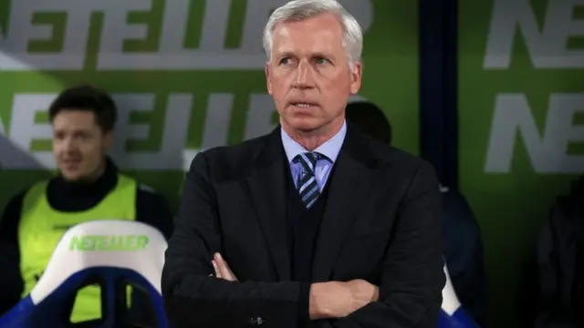 Alan Pardew looks on