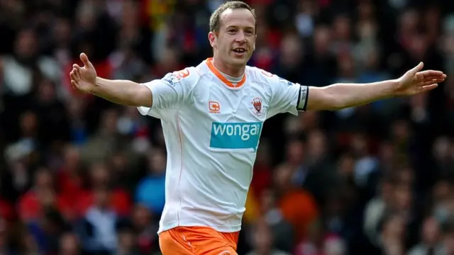 Charlie Adam celebrates while playing for Blackpool