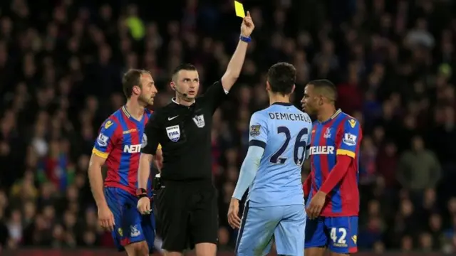 Martin Demichelis is given a yellow card