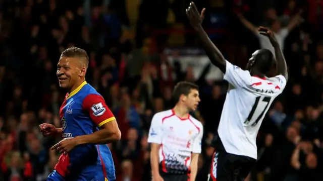 Dwight Gayle celebrates scoring against Liverpool