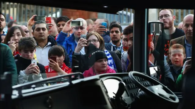 Fans waiting outside the team coach