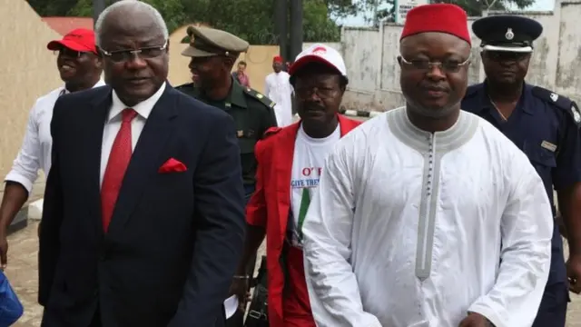 Sierra Leone's President Ernest Bai Koroma (L) and Samuel Sam-Sumana arrive at the National Electoral Commission in Freetown on 11 October 2012