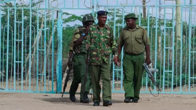 Kenyan police officers provide security during a special prayer service for the 148 people killed in an attack on Garissa University College