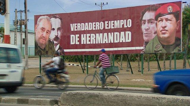 Billboard that shows a picture of Castro and Chavez