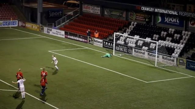 Leah Williamson celebrates scoring her penalty