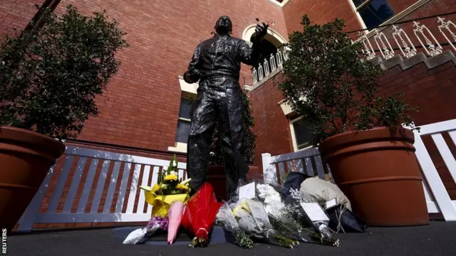 Flowers have been laid at the base of a statue of late Australia cricket captain Richie Benaud, located at the Sydney Cricket Ground