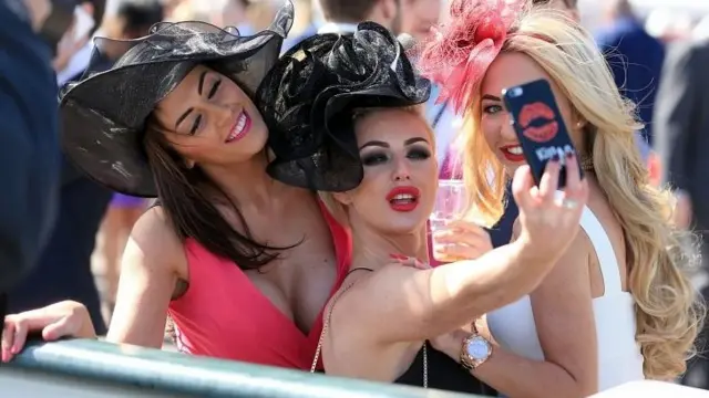 Racegoers take a selfie