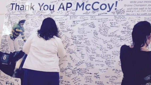 Fans write on an AP McCoy tribute wall