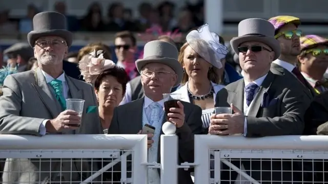 Racegoers watch the action