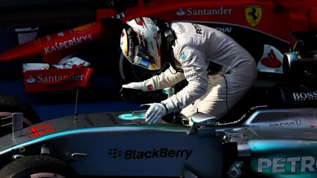 Lewis Hamilton pats his car after winning the Chinese Grand Prix