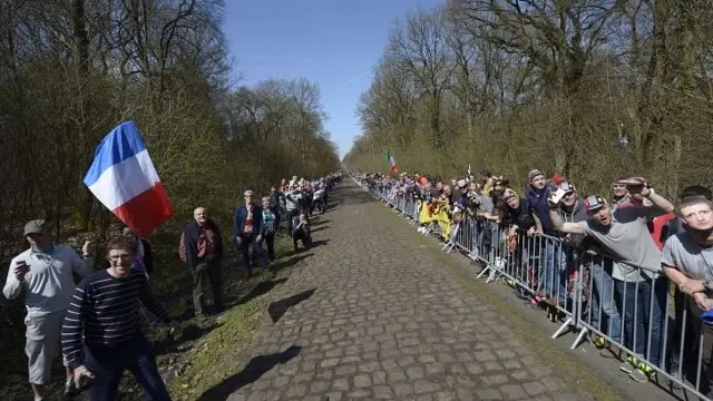 People line the section of the route known as the Trouee d'Arenberg