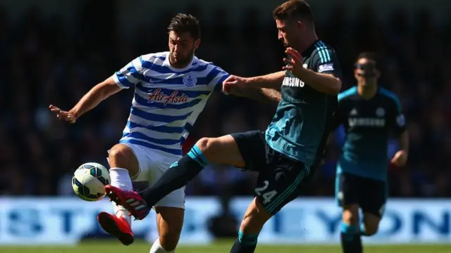 Charlie Austin nips in front of Gary Cahill