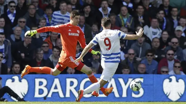 Thibaut Courtois clears the ball