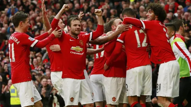 United celebrate their fourth goal