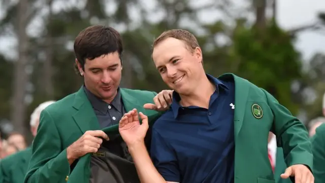 Jordan Spieth (right) gets the green jacket from last year's winner Bubba Watson