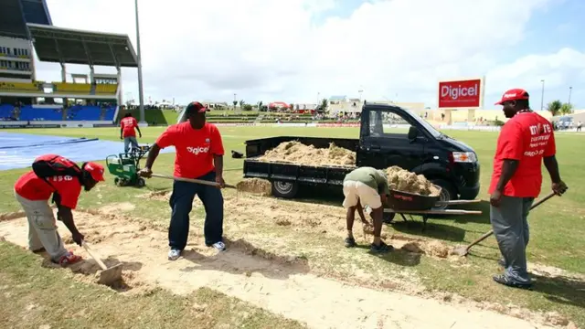 Groundsmen work on the pitch during the abandoned Test in Antigua in 2009