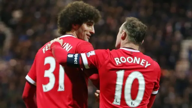 Manchester United striker Wayne Rooney and team-mate Marouane Fellaini