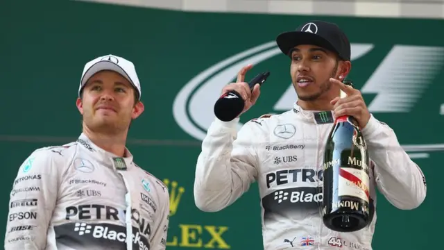 Mercedes drivers Lewis Hamilton (right) and Nico Rosberg