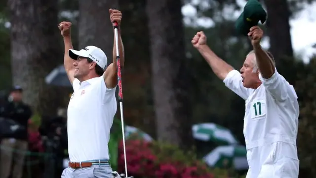 Adam Scott celebrates with his caddy