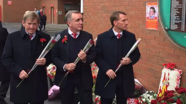 Kenny Dalglish, Liverpool Football Club Chief Executive Ian Ayre, and manager Brendan Rodgers laying flowers at Hillsborough memorial