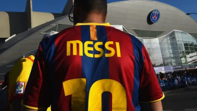 A Barcelona fan with a Messi shirt on outside the ground