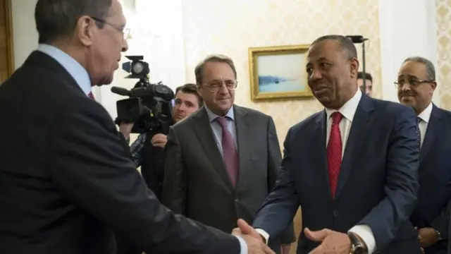 Russian Foreign Minister Sergey Lavrov shakes hands with Libyan Prime Minister Abdullah al-Thani, second right, in Moscow