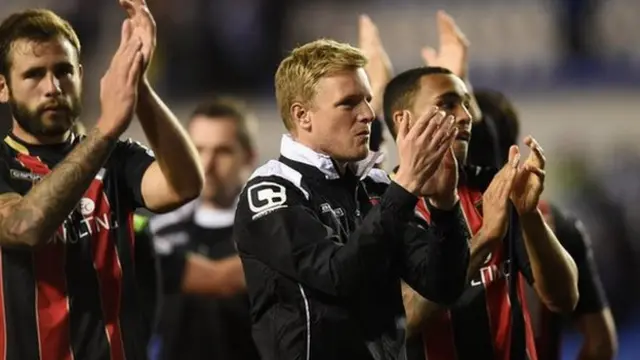 Eddie Howe (centre) at the Madejski Stadium