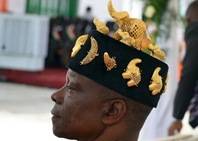 A traditional chief wears a hat decorated with golden elephants during the inauguration of the Mohammed VI Expressway, a 4,6 km expressway named after Moroccan King Mohammed VI and linking the Abobo and Anyama northern districts of Abidjan, on 11 April 2015 in Anyama