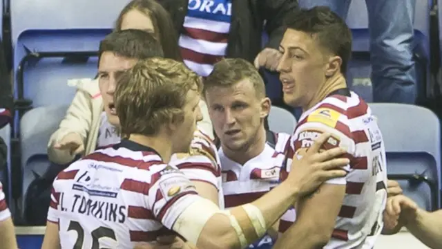 Wigan celebrate Dom Manfredi's second try