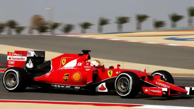 Sebastian Vettel with palm trees blowing behind