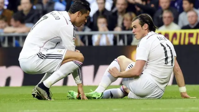 Gareth Bale sits injured