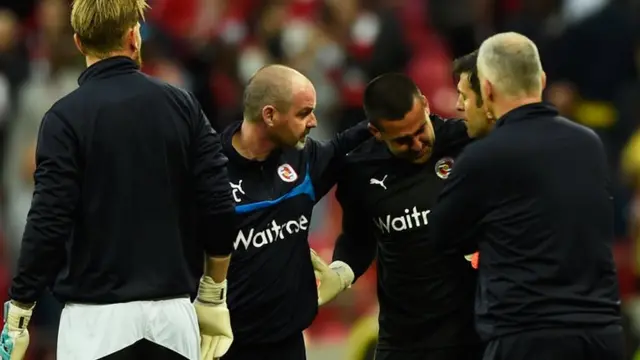 Reading keeper Adam Federici is consoled by manager Steve Clarke