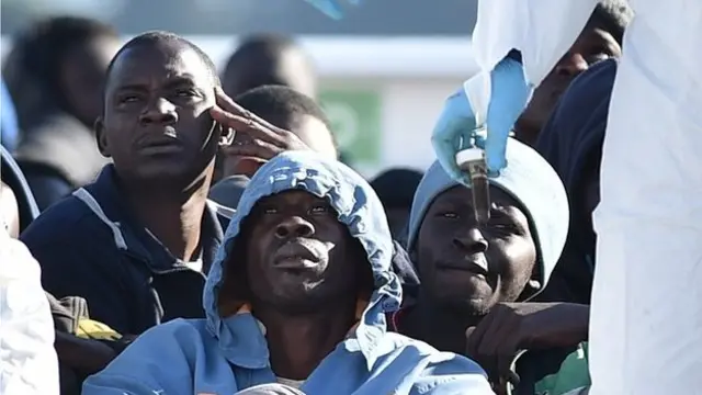 Migrants waiting to disembark in near Siracusa, Sicily, 16 Apr 15