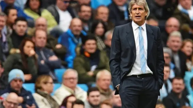 Manuel Pellegrini stands on the touchline