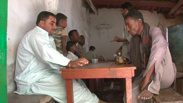 Local men in Gwadar, Pakistan sitting around a table